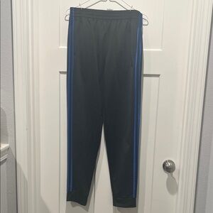 Adidas Black Track Pants with Blue Stripes.  Size XL.  Never worn.  No tags.